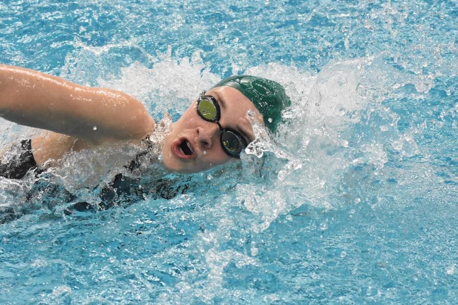 Freshman Andie Unwin swims one of her eight races at the state swim meet.