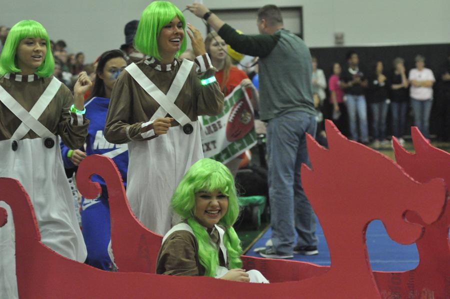 Juniors Audrey Manning, Katy Majerus, and Kassidy Luck dressed as Oompa Loompas in the Red Wagon competition on October 28.