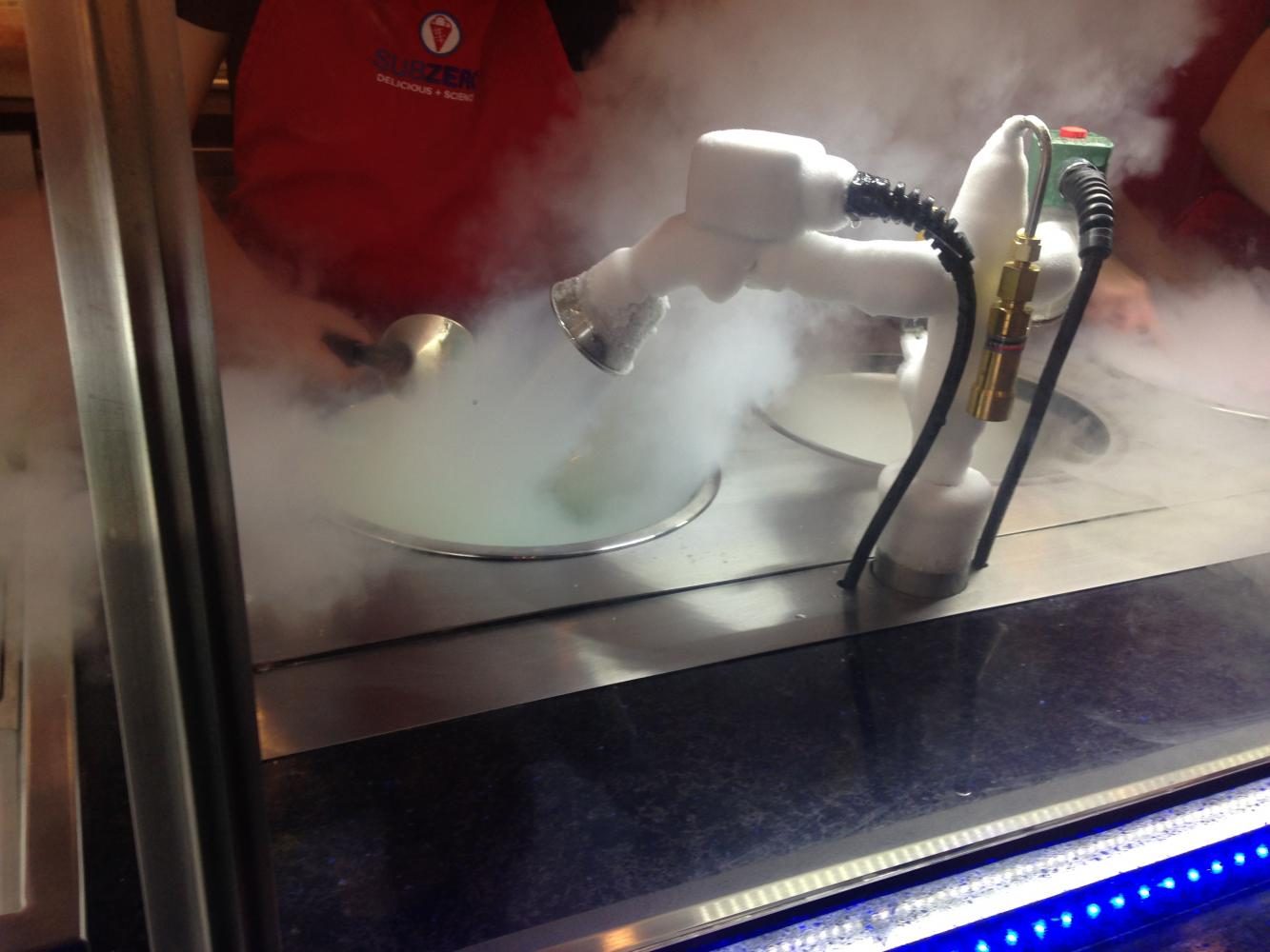 A Sub Zero employee freezes ice cream with liquid nitrogen. 