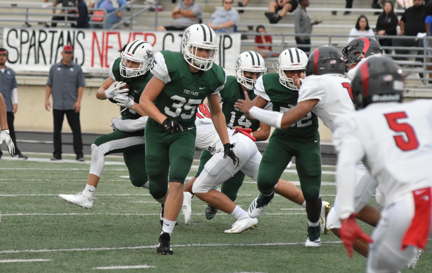 Against Porter, sophomore Brady Cole tries to clear a path for junior Canen Adrian. The Panthers came from behind to defeat Porter.