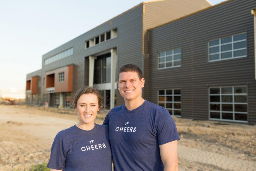 Brooks and Shelby Powell, who both graduated from Kingwood Park in 2012, stand outside of their new office building that is almost done being built.