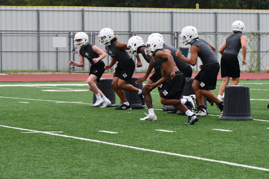 During fifth period practice, the varsity football players work on drills to prepare for their season opener this weekend against Pasadena South Houston. The team played a scrimmage last weekend.