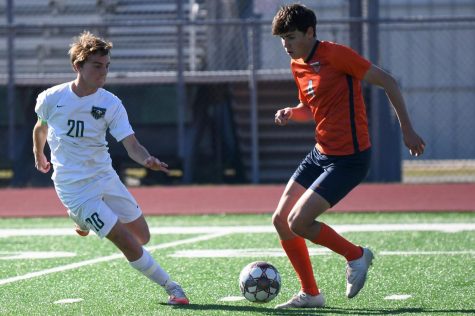 Senior forward Jace Banning faces off against a Bridgeland player on Jan. 14. The Panthers lost 2-0. 