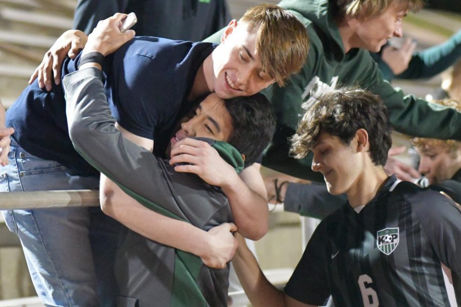 Peyton Adkins, a 2020 alum, hugs senior Jesus Cervantes after the Panthers defeated Weiss in the playoffs. Adkins was a member of last years team, which finished rank No. 1 in the state but did not get a chance to compete in the playoffs because of COVID.