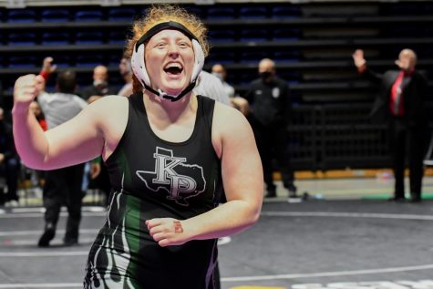 Senior Lexi Shannon looks toward her family and friends after winning her first state title on April 23. 