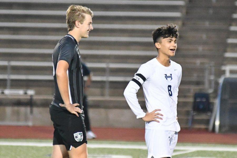Senior Park Ryan talks with a Hendrickson player in a break in the action during the Region Final. 