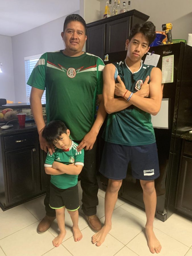 Jesse Cervantes, his father Gilbert and younger brother Adan get ready to watch a Mexico soccer game on July 2.