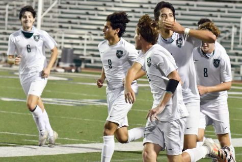 Against Valley View in the state semifinals, senior Jesus Cervantes blows a kiss toward the fans in the stands after scoring his first goal of the game in the second half. 