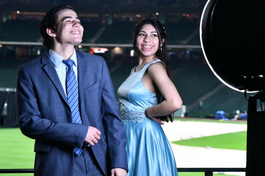 Andres Aristimuno and Sofia Garcia pose for the photo booth ring light at prom on May 1. 