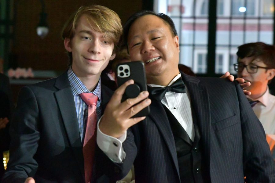 Senior Ian Prigmore takes a selfie with calculus teacher Jim Dang during prom. Dang chaperoned the dance from 8-11 p.m. 