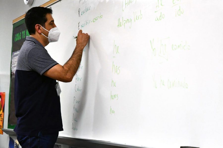 Jose Sanchez works on conjugations with his seventh period class in May. 