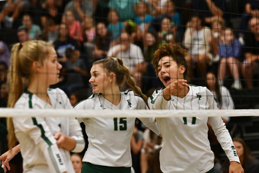Senior Charlee Jordan helps give direction on the court with junior Ashley Cox and senior Ashley Forrest lining up in the front row with her. The Panthers lost in four sets to Kingwood HS on Aug. 20. 