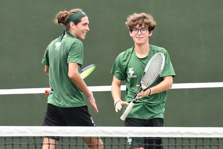 Juniors Sean Helton and Talmage Hammond celebrate after scoring a point in their doubles match on Aug. 13.