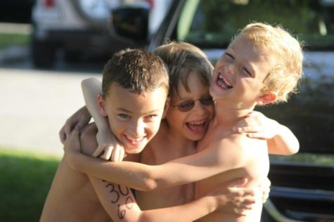 Barrett Kenny, Landon Ahrendt and Michael Kell laugh during a Trailwood Gators swim meet. The three of them became friends in first grade when Kell heard Ahrendt and Kenny talking about Yoshi and joined the conversation. The three of them would call each other by the nicknames Boshi, Loshi and Moshi, replacing the ‘Y’ in Yoshi with the first letter of their names.