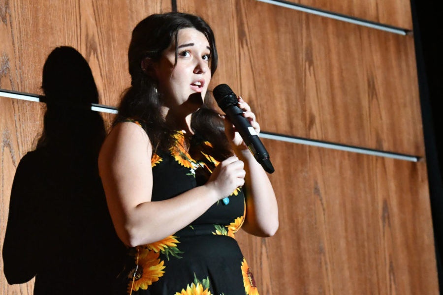 Senior Suzanne Durand sings Leader of the Band as a solo to a large crowd at the choirs annual Pop Show on Oct. 26. 
