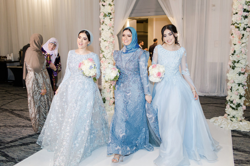 Junior Meraa Husainat walks down the aisle with family members during her brother’s wedding last summer. 