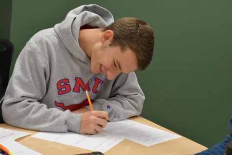 Senior Evan Hebert works on class work during AP Calculus BC. He was the only senior named as a National Merit semifinalist on campus.