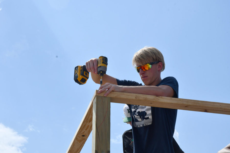 Senior Carter Bennett drills part of the frame of this year’s Tiny Home, which he designed. He is working on the Kingwood Park’s fourth Tiny Home, while also helping Kingwood High School build their first. 