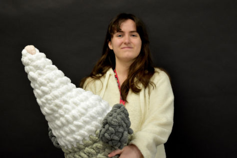 Junior Layla Tafarroji holds her giant opposum, which took her about 6-8 hours to crochet.