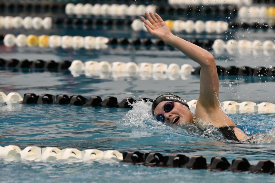 Junior Carlie Solomon competes during the team’s final home meet of the season on Jan. 7. She has competed at the state championships as a freshman and a sophomore.