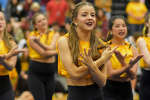 Senior Charlee Poulin participates in a Silver Stars dance routine during a September pep rally. 