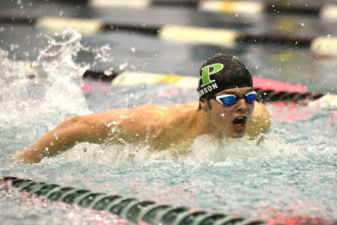 Senior Mick Johnson competes in the butterfly during the senior night meet on Jan. 7. 