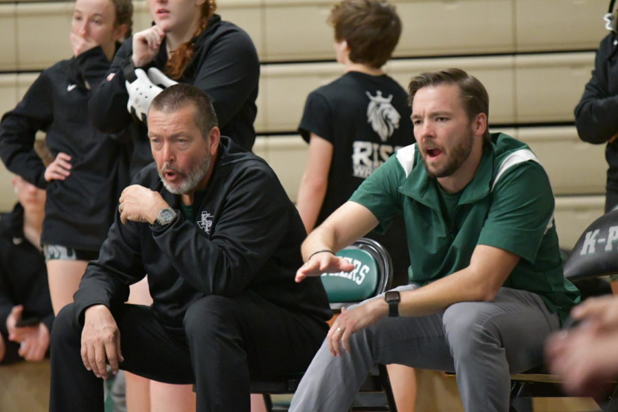 Head wrestling coach Jeff Knight and assistant coach Eric Coovert yell from the coach’s corner on the 2022 senior night. The coaches brought thirteen athletes to the regional competition and will be bringing three athletes to the state competition.