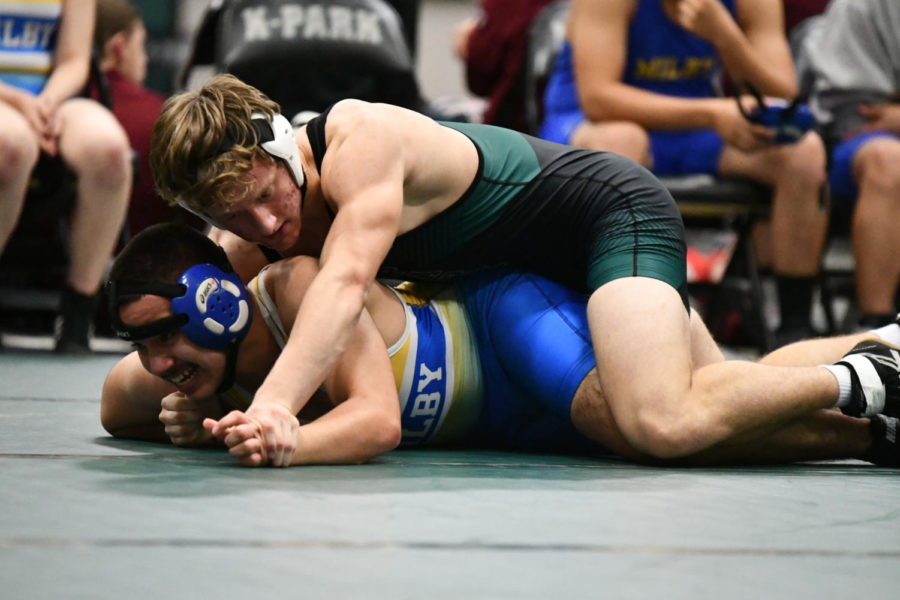Sophomore wrestler Alex Wright attempts to prepare a move during a match on Jan. 12.
