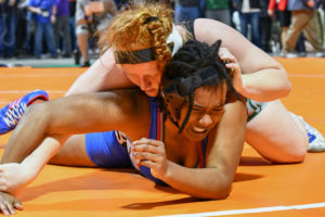 Senior Lexi Shannon works to turn Kashmeres Samyra Thomas in the state championship match. Shannon won by pin.