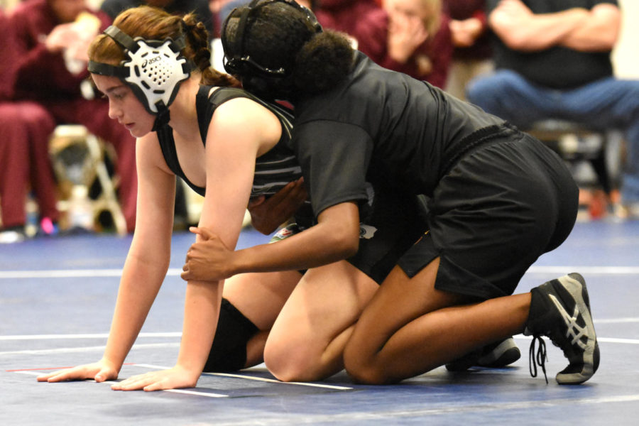 Freshman+Khloe+King+competes+against+Summer+Creek+on+Dec.+17.+King+wrestled+through+pain+much+of+the+season+before+ultimately+breaking+her+finger+at+the+region+meet.