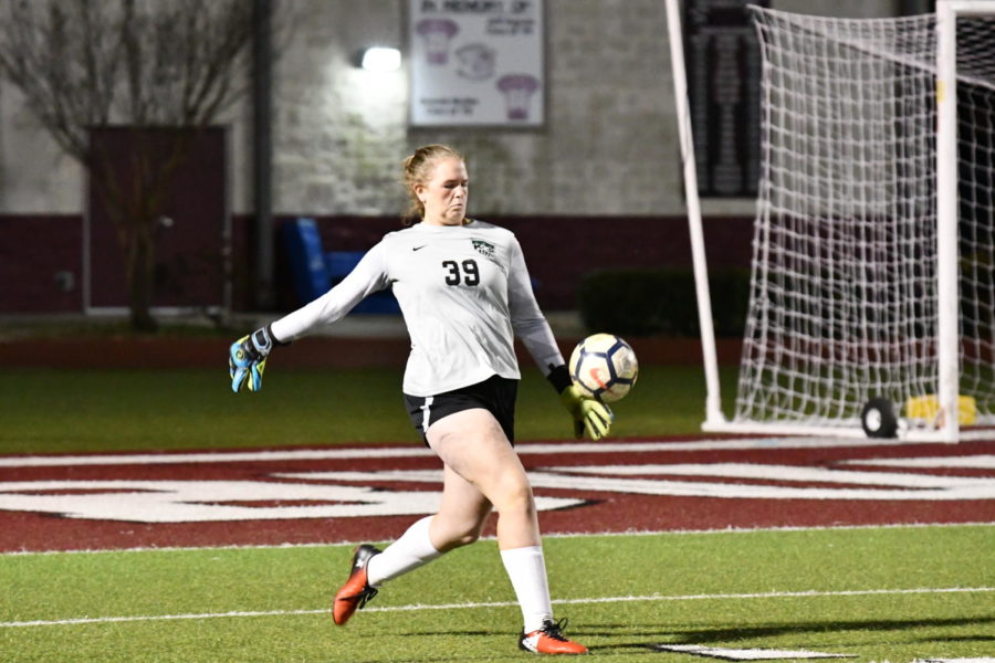 Freshman goalkeeper Courtney Daniel punts the ball during overtime against College Station in the bi-district championship.