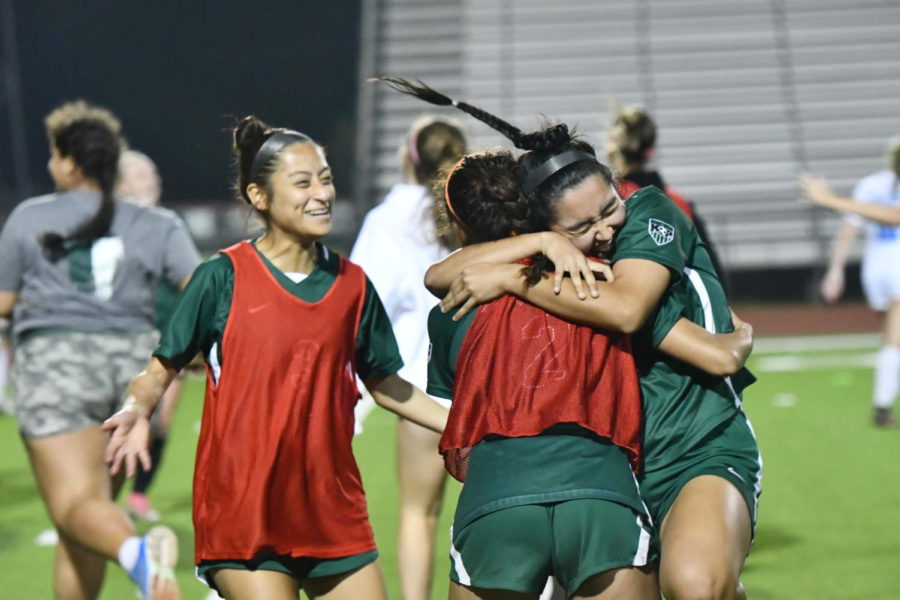 Elizabeth Carvajal celebrates at the end of regulation in the Area championships with Emmy Segura and Brianna Quiararte.