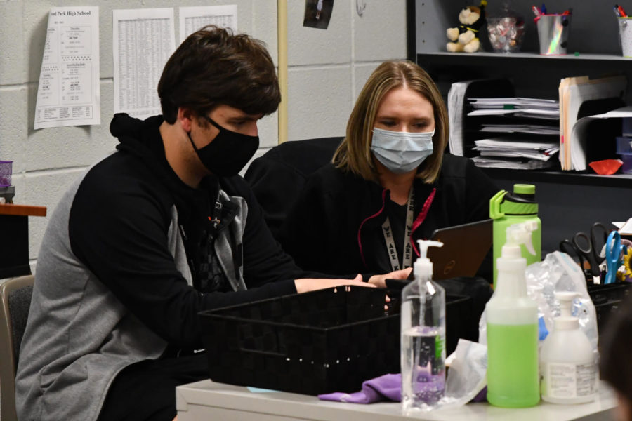 Stats teacher Shannon Wenter works with a student during fifth period in April. 