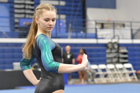 Sophomore Sydney Gilstrap competes in the floor routine at the Kingwood High School gymnastics meet in February. She will compete at the state meet in Dallas on April 20.