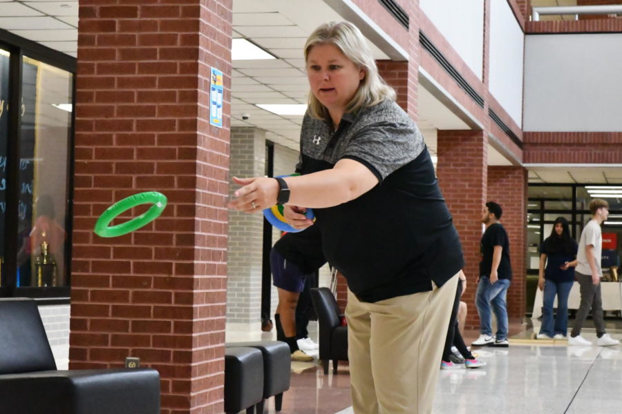 Math teacher LeighAnn Wolfe participates in the carnival her students set up in the commons for their project.