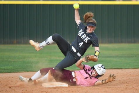 Freshman Lizzy Quinn collides with a runner at second while trying to make an out in the first-round playoff game. 
