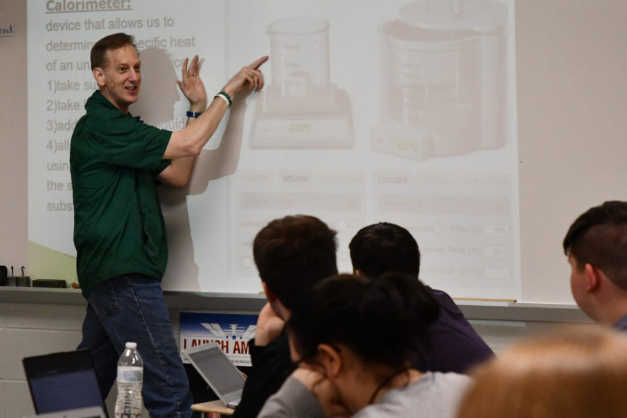 Glenn Taylor explains a lesson to his fifth period OnRamps physics class.