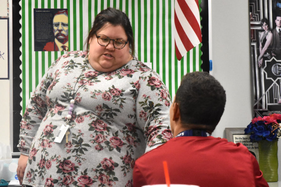 English teacher Laura Whitfield talks with Luc Wehby during 7th period English.