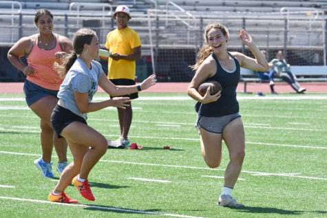 Sophomore Erin McLain races past defenders in their teams last practice before the powder puff game. The teams held about six practices prior to tonights games. 
