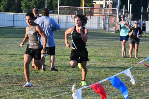 Sophomore Carson Brown races to the finish line as he attempts to pass a Dayton runner.