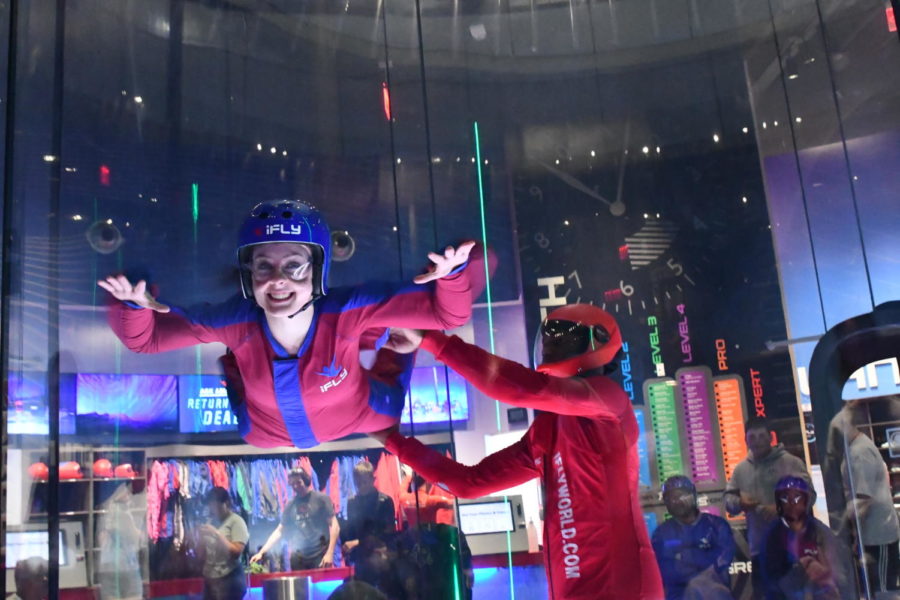 Smiling while taking a float in the air, senior Kimberly Kirsch enjoys her day at iFly.