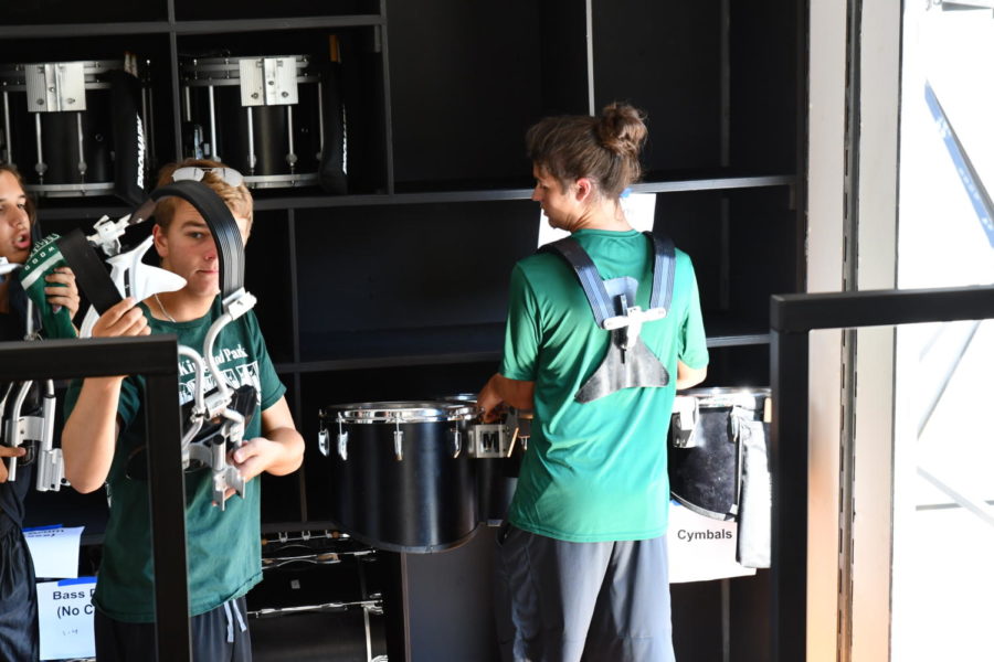Band students load up their instruments prior to a football game at Turner Stadium. The multiple levels and built-in shelves help speed up the packing process.