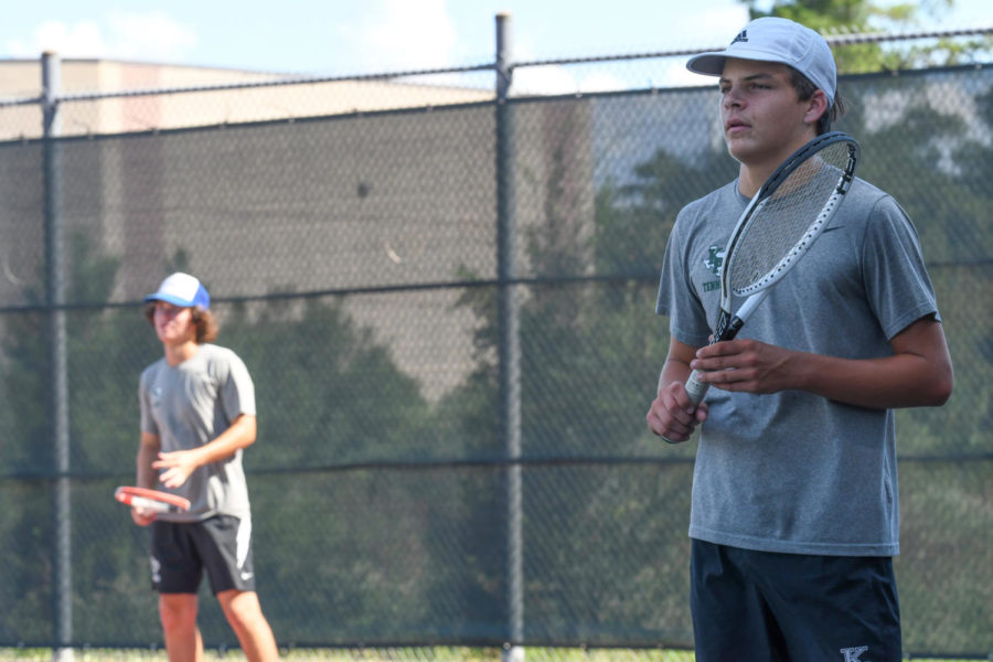 Trent Lawson, with doubles partner Talmage Hammond, await a serve against Nacogdoches earlier this season.