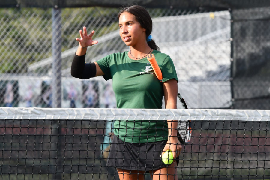 Senior Sophia Sifontes talks to a teammate before starting a match against Lake Creek on Sept. 23. 