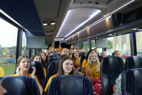 The volleyball team records a video thanking the district for the charter bus before taking off for their matches against Nacogdoches on Sept. 23.