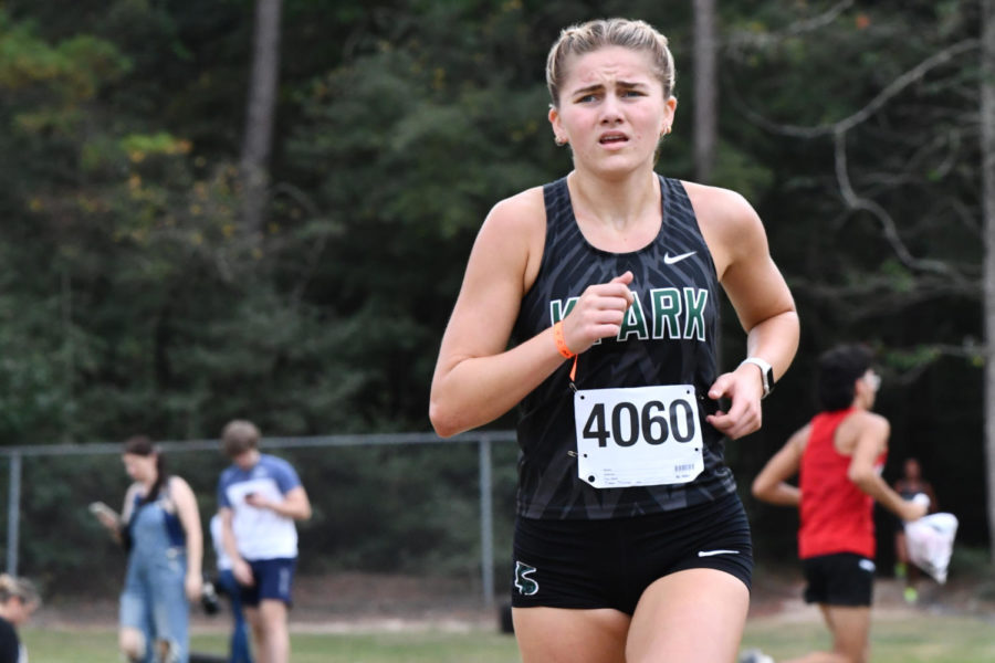 Sophomore Lucy Foltz stays ahead of the pack as she crosses the halfway point of the district championships. Foltz went on to finish first with a time of 19:05.21.