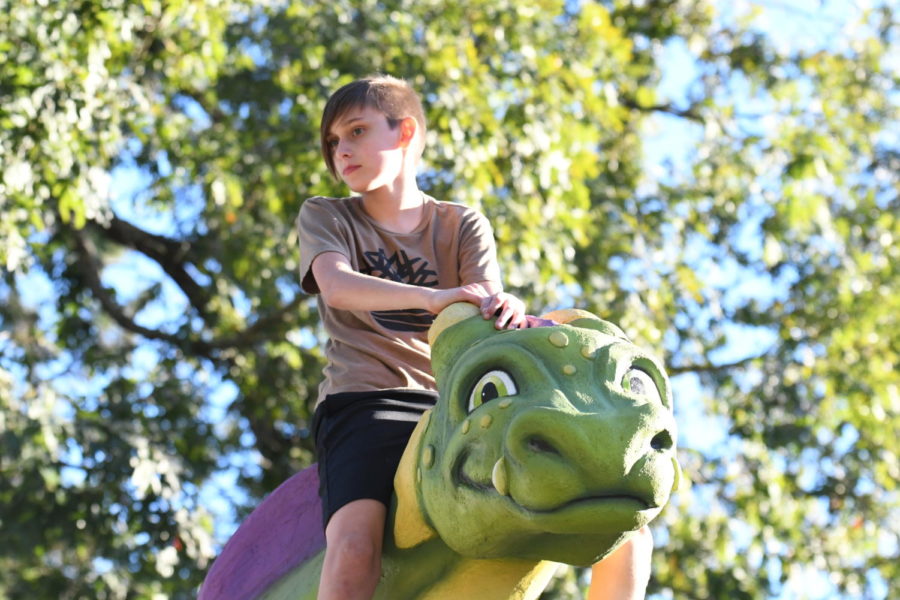 The Fairytale-themed new playground at Woodland Hills Elementary boasts a large green dragon students love to climb.