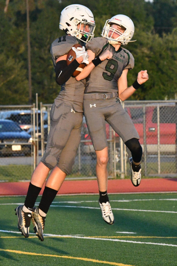 Luke Elliott celebrates with quarterback Bryce Gerbasich after Elliott caught Gerbasich’s touchdown pass against Baytown Lee on Sept. 15.