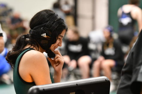 Sophomore Lea Barron talks to one of the officials at the tournament before her match. 