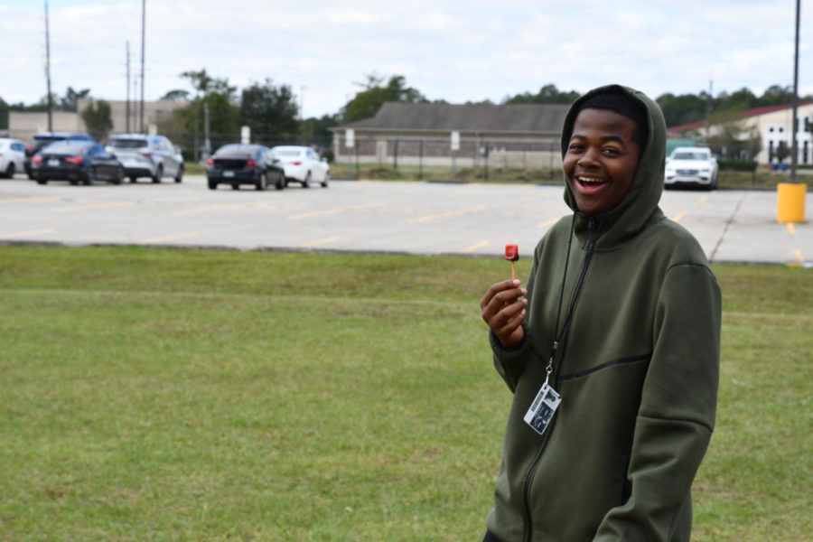 Freshman Anthony Henry laughs as he enjoys his time outside at the Jack Field Elementary school playground.